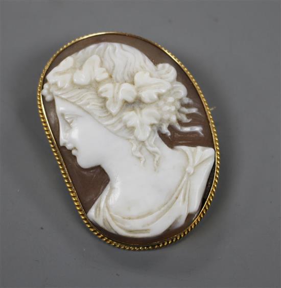 A 15ct mounted cameo brooch, carved with the bust of a lady 42mm.